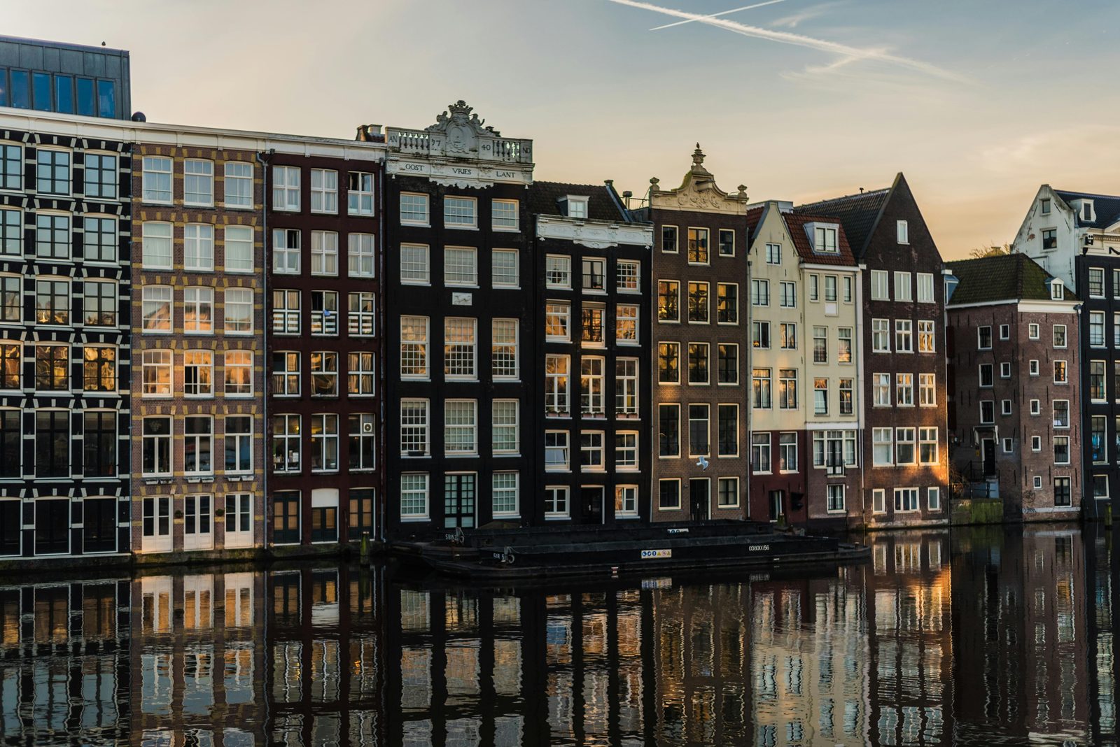 European canal with colorful houses at sunset — Nyhavn-area hotels offer the iconic Copenhagen waterfront for first-time visitors