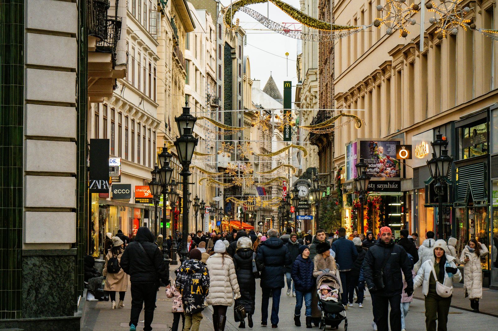 Busy European pedestrian shopping street — staying near Strøget (Europe's longest pedestrian street) is the classic first-time Copenhagen choice